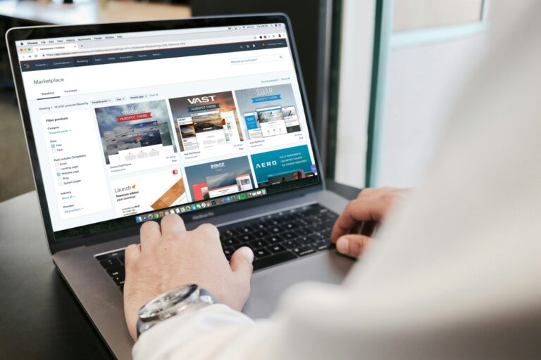 A human typing on a laptop
